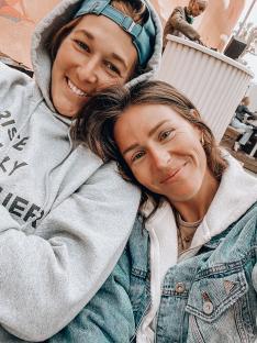 Close-up photo of two women embracing.