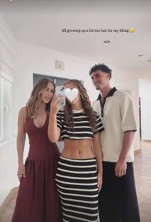 Photo of Kate Ferdinand with her stepson and another person.
