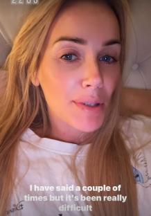 Close-up of Laura Anderson looking distressed.