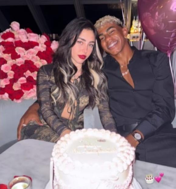 Lamine Yamal with a woman at a birthday celebration.