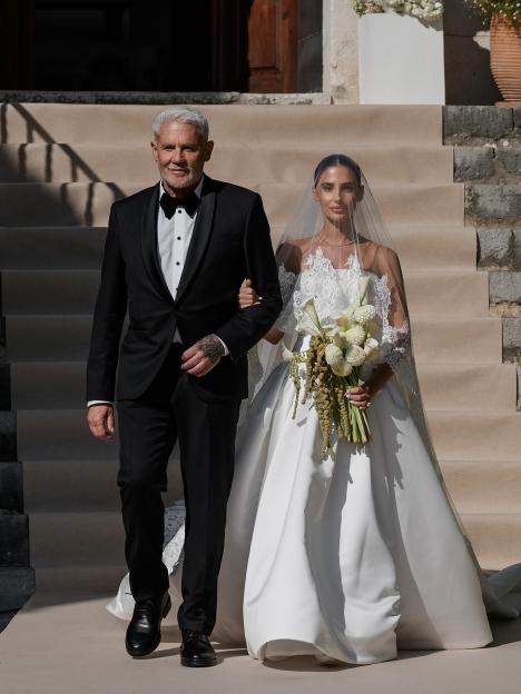 Bride and her father walking down the aisle.