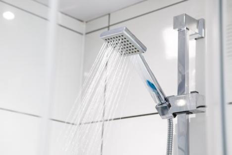 Shower head with water running.