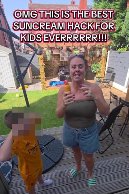 Woman in a garden demonstrating a suncream hack for kids.