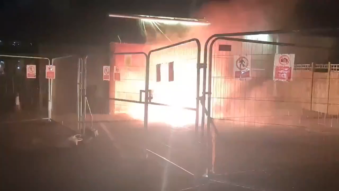 Flares near migrant hotel.
