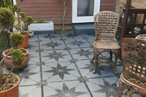 I never liked our boring patio but couldn’t afford to replace it – I transformed it with Amazon hacks & saved thousands