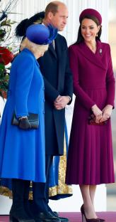 Camilla, Queen Consort, Prince William, and Catherine, Princess of Wales at a ceremonial welcome.