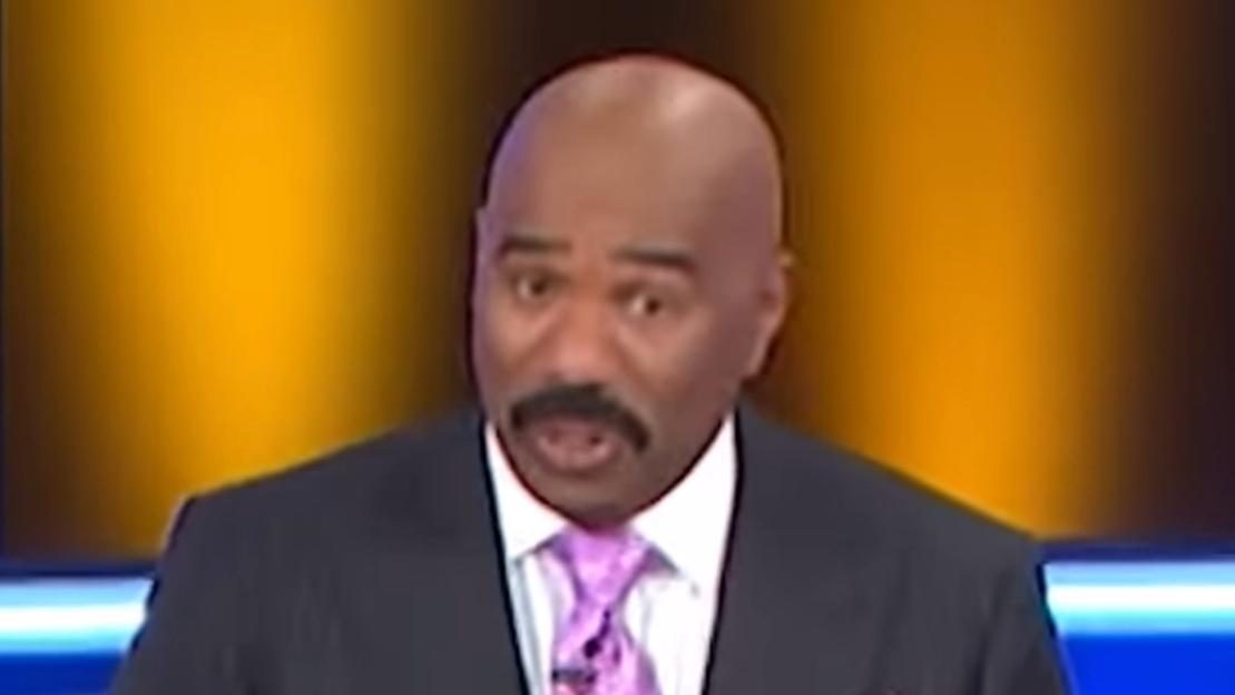 Family Feud contestant makes raunchy gesture with tongue as shocked host Steve Harvey left speechless in NSFW clip