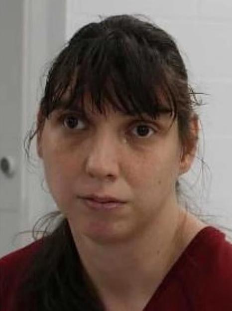Mugshot of a woman arrested in connection with five children found in deplorable conditions.