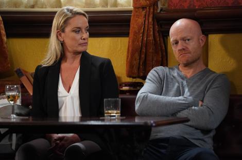 Melanie Owen and Max Branning seated at a table in a pub.