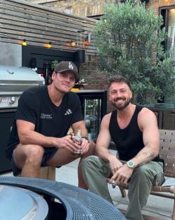 Sam Thompson and a friend relaxing outdoors.