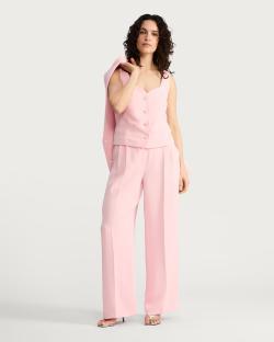 Woman in pink pantsuit.