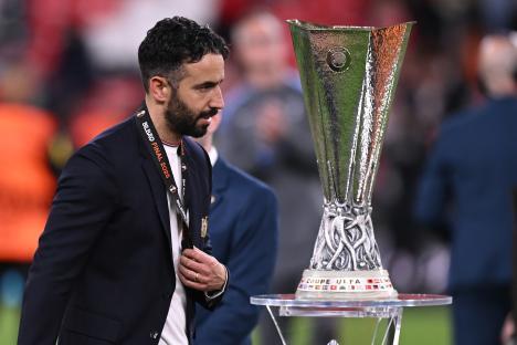Ruben Amorim of Manchester United near the UEFA Europa League trophy.
