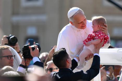 Pope Leo holds baby & waves to crowds in St Peter’s Square as world leaders gather for Pontiff’s inauguration mass
