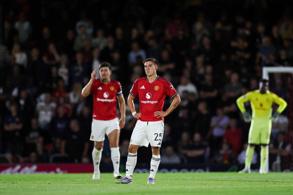 Manchester United players on the field after a goal.