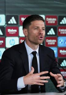Xabi Alonso speaking at a press conference.