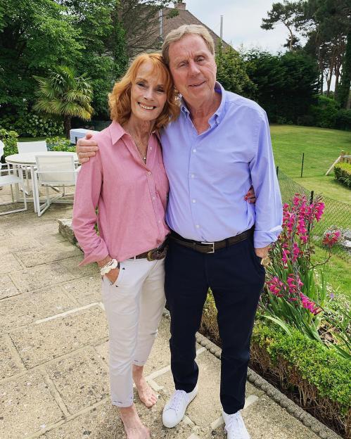 Harry Redknapp and his wife Sandra standing together outdoors.