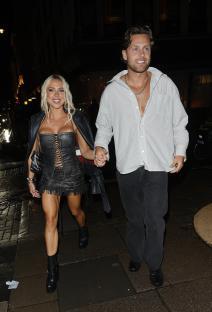 Casey O'Gorman and Gabby Allen holding hands.