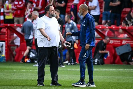 Nottingham Forest's manager and co-owner speaking on the sidelines.