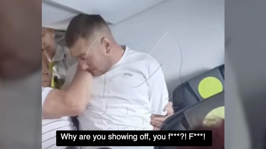 A restrained passenger on an airplane.