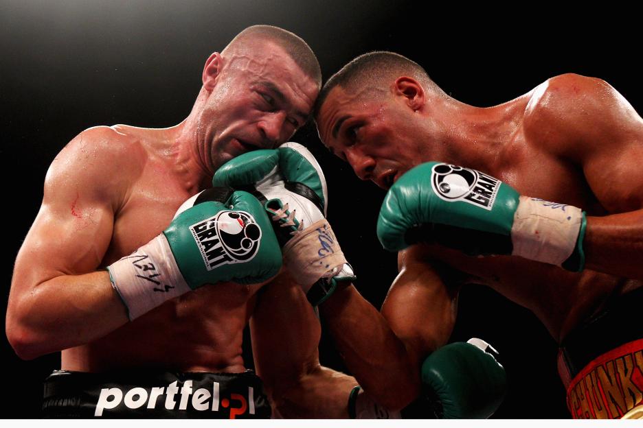 Two boxers, Piotr Wilczewski and James DeGale, exchanging blows during the European Super-Middleweight Championship.