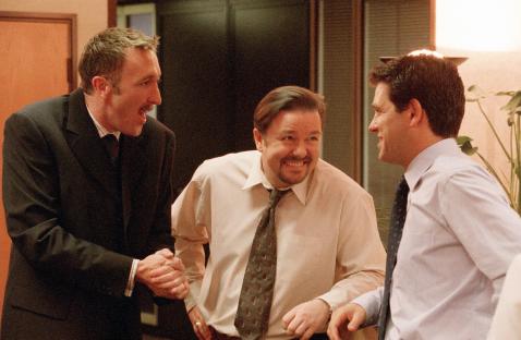 Scene from the BBC's The Office showing David Brent, Chris Finch, and Neil Goodman.
