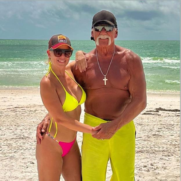 Hulk Hogan and his wife on a beach.