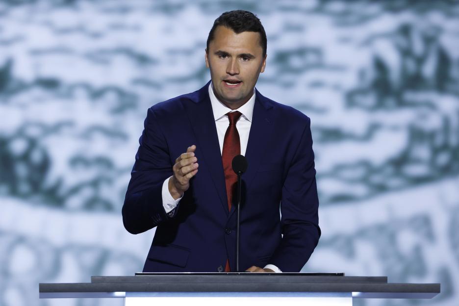 Charlie Kirk speaking at a podium at the Republican National Convention.