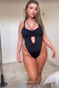 Bethan Kershaw in a light gray top and headband.