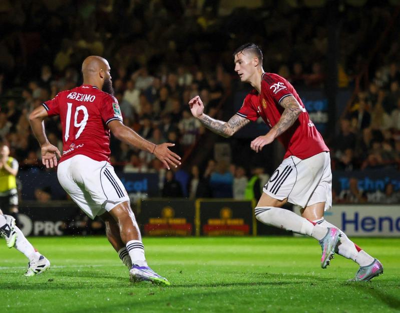Manchester United players celebrating a goal.