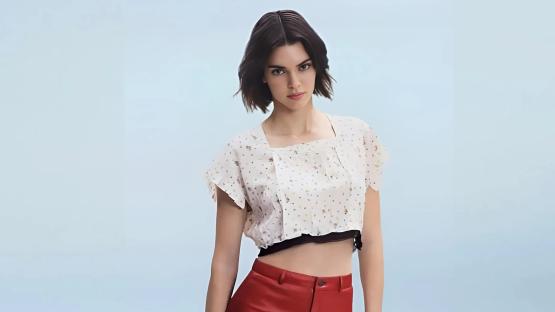 Kendall Jenner stuns in tiny red shorts and crop top on a pink boat after partying at Coachella
