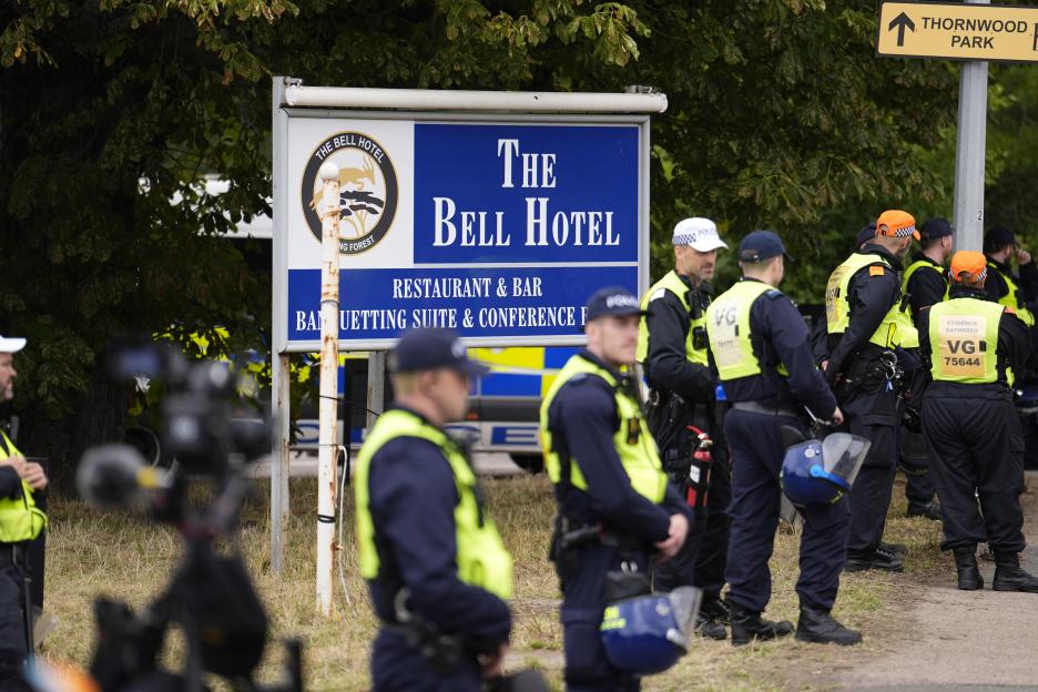 Police officers outside The Bell Hotel.