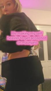 Person wearing a black top and leggings with water bottles tucked into their waistband, text overlay reads