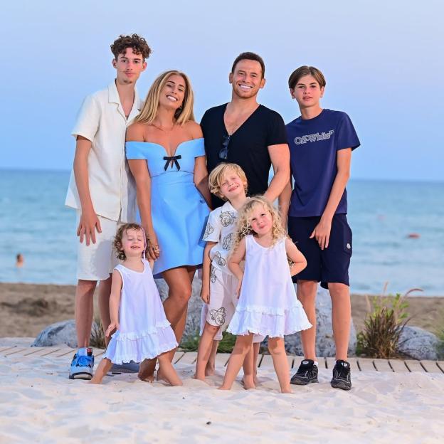 Stacey Solomon and her family on a beach.