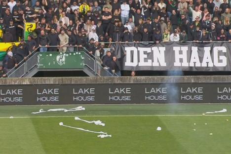 Play-off clash ABANDONED as furious fans throw fireworks and toilet roll on pitch before team forced to forfeit match