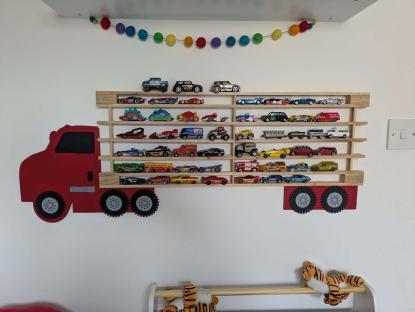 Toy car shelf shaped like a truck.