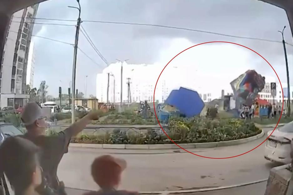 Watch terrifying moment bouncy castle is thrown into the air during horror gales leaving at least four children injured