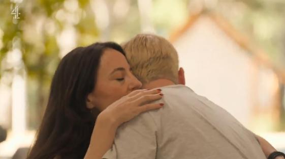 A woman embracing a man.