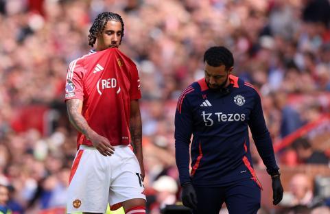 Leny Yoro of Manchester United leaves the field with an injury.