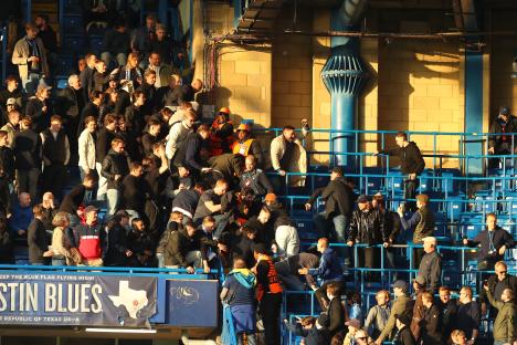 Chelsea and Djurgarden fans clashing in the stands at Stamford Bridge.
