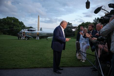 President Trump speaking to reporters on the White House lawn.