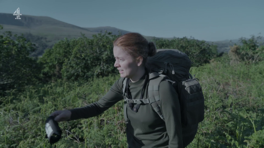 Woman hiking with backpack.