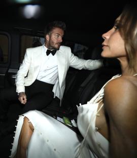 David and Victoria Beckham in a car.