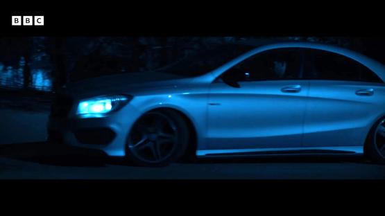 A car driving at night.