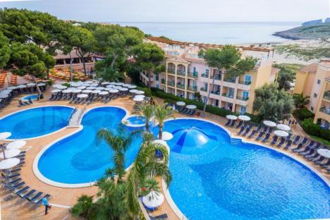 Aerial view of Zafiro Cala Mesquida resort in Majorca, showing the pool and hotel buildings.