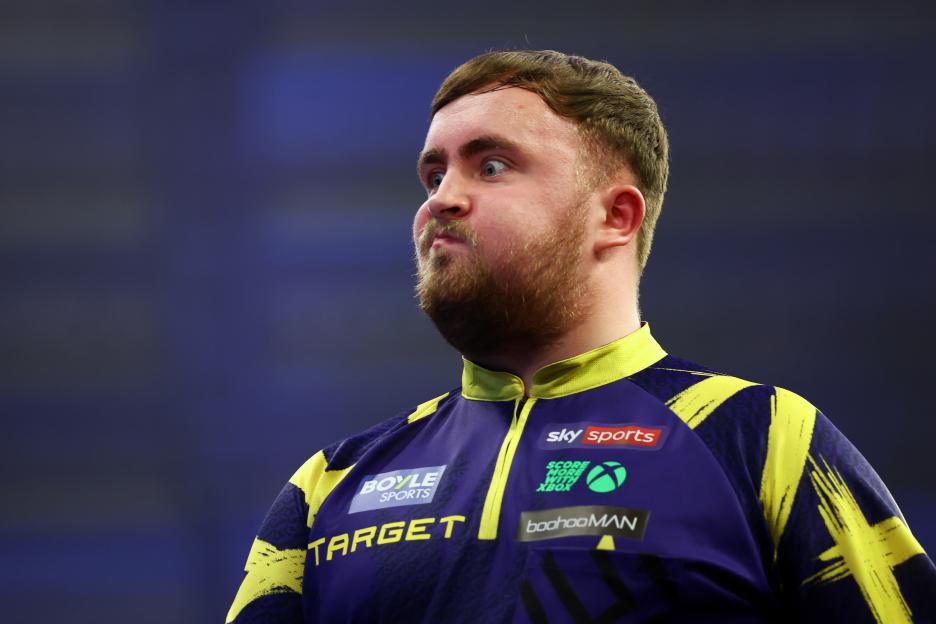 Luke Littler of England reacts during his round two match.