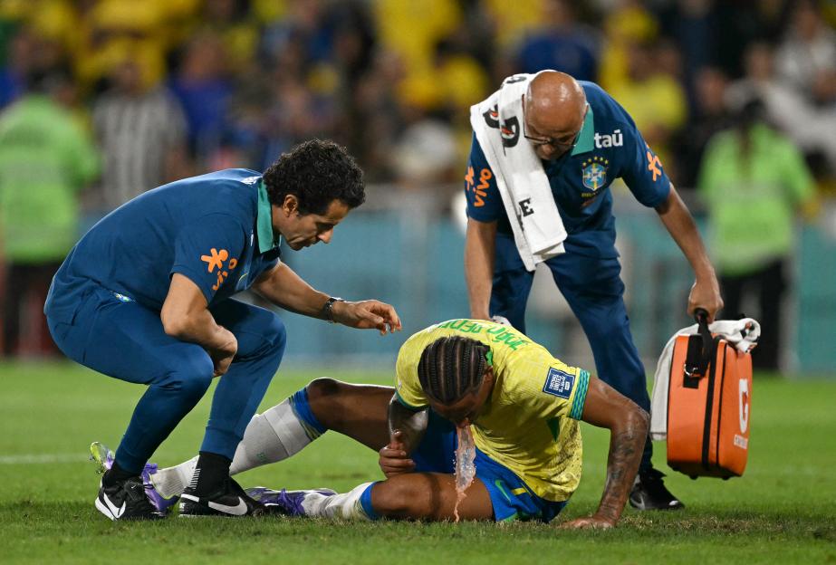 Worrying moment Joao Pedro VOMITS on pitch after colliding with own team-mate Martinelli leaves Chelsea fans concerned