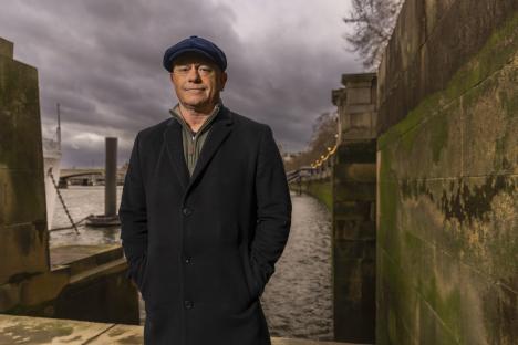 Ross Kemp standing outdoors, hands in pockets.