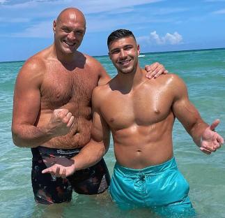Tyson Fury and Tommy Fury in the ocean.