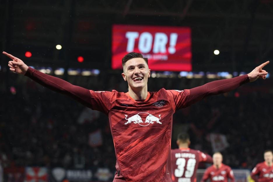 Benjamin Sesko of RB Leipzig celebrates scoring a goal.