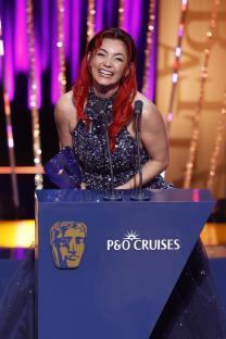 Dianne Buswell accepting a BAFTA award.